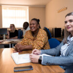 Learners sitting at table
