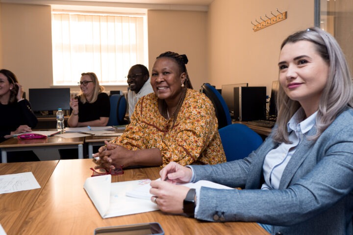 Learners sitting at table