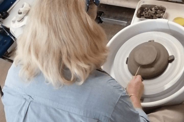 Learner using pottery wheel