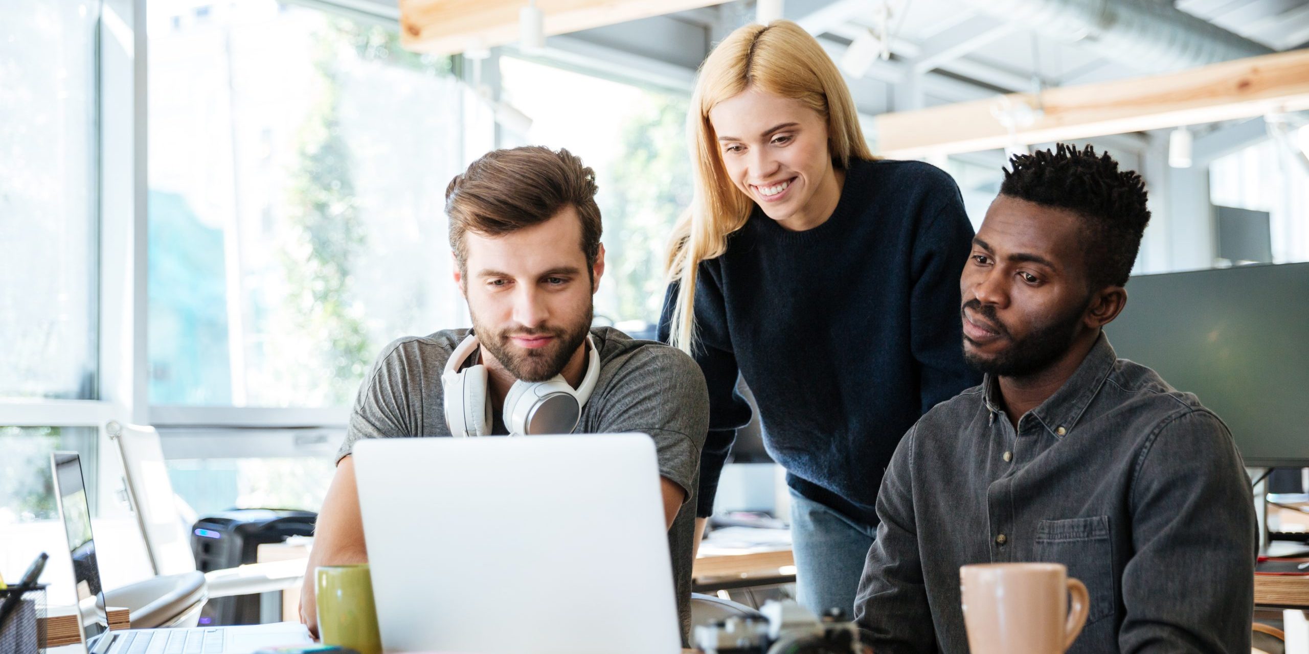 Group of people working on laptop