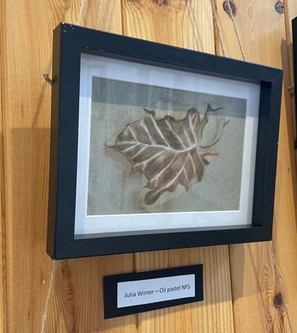 Pastel drawn image of a leaf, brown, wall mounted, black frame