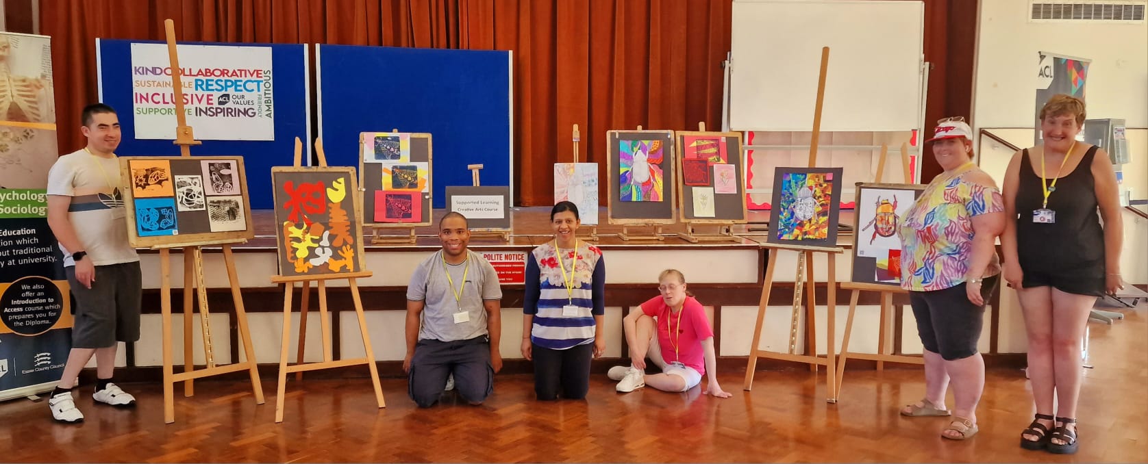Group amongst paintings